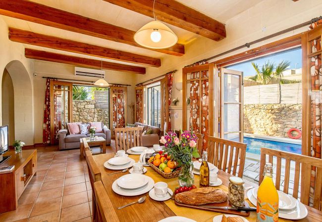 Dining room of gozo holiday farmhouse with pool