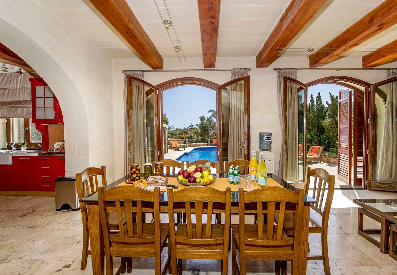 dining area looking onto private pool of malta holiday villa