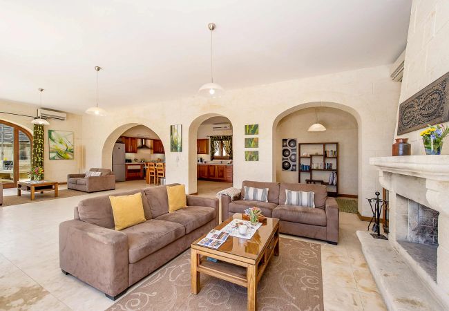 living room of gozo villa with fireplace