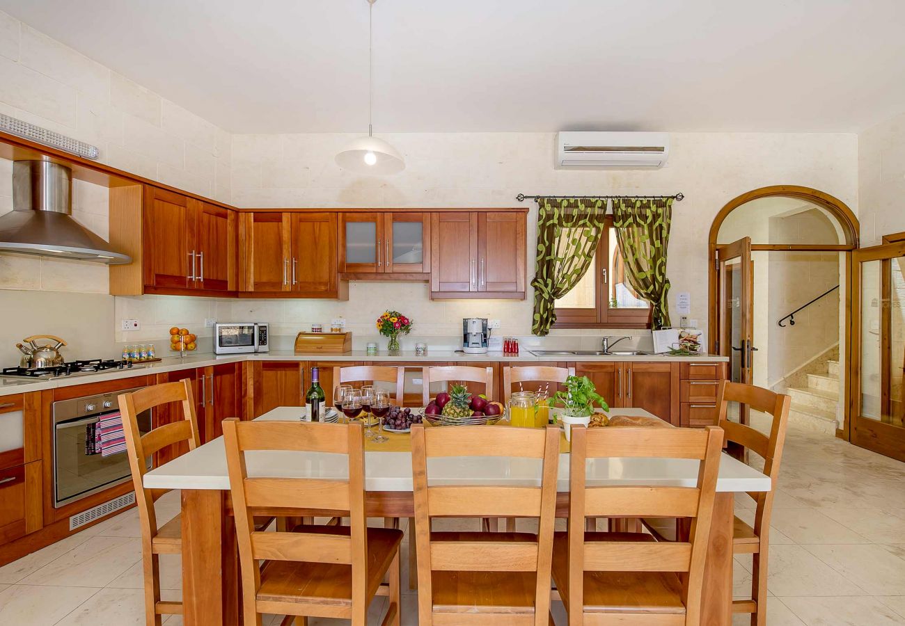 kitchen and dining area of luxury villa in gozo
